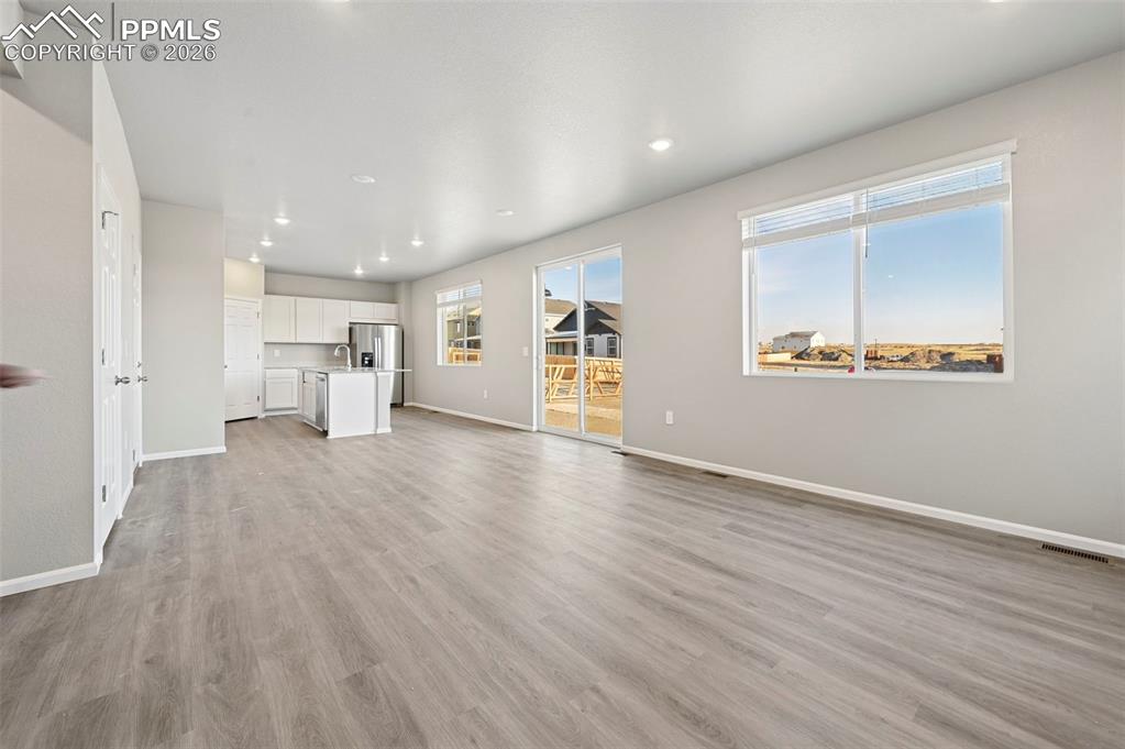 Unstaged living room, large open concept 