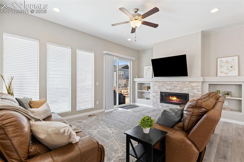 Fireplace flanked w/ custom built-ins