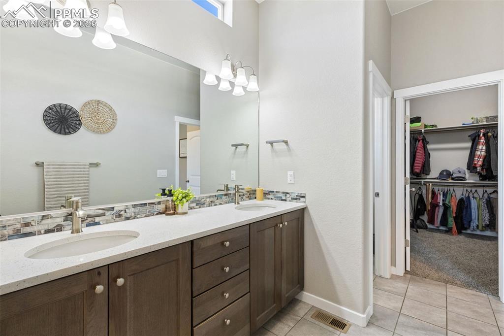 Primary bath facing walk-in closet & water closet toilet