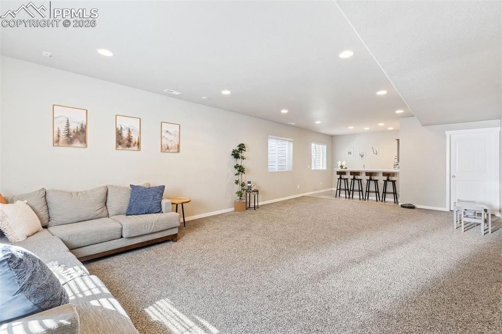 Huge basement area w/ wet bar and storage at the other end