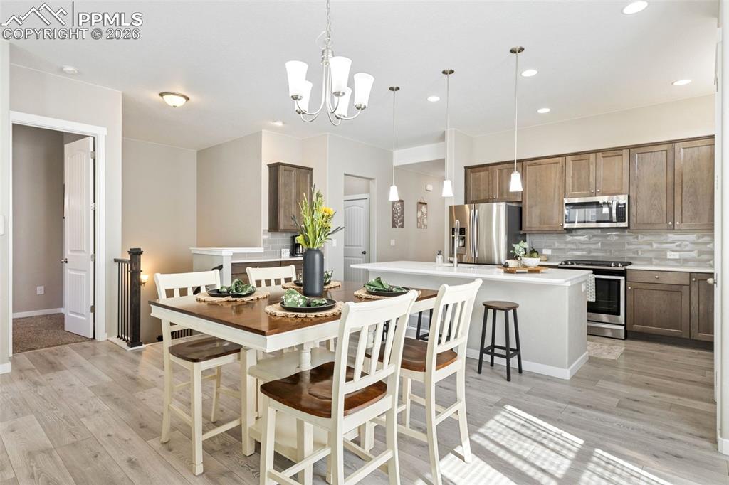 Open concept kitchen & dining. Primary bdrm door on the left
