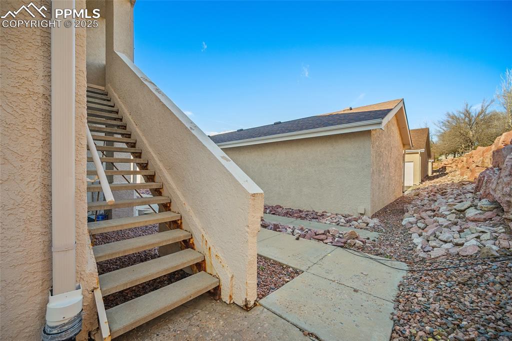 path to garage from bottom of home stairs
