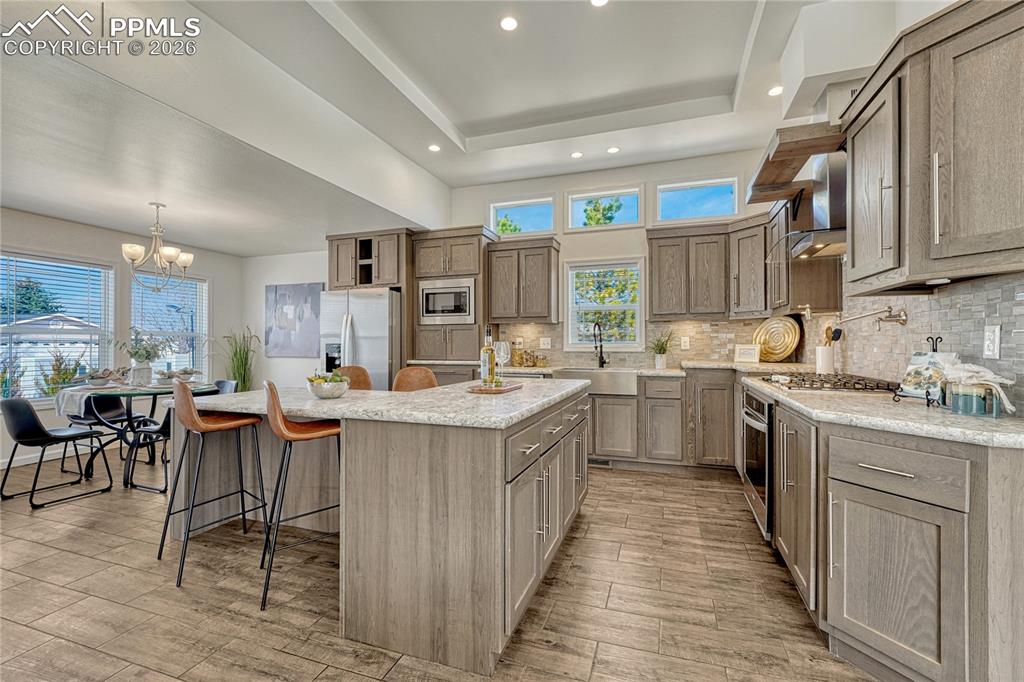 Clerestory windows, recessed and under cabinet lighting makes the space evenly lit any time of day.
