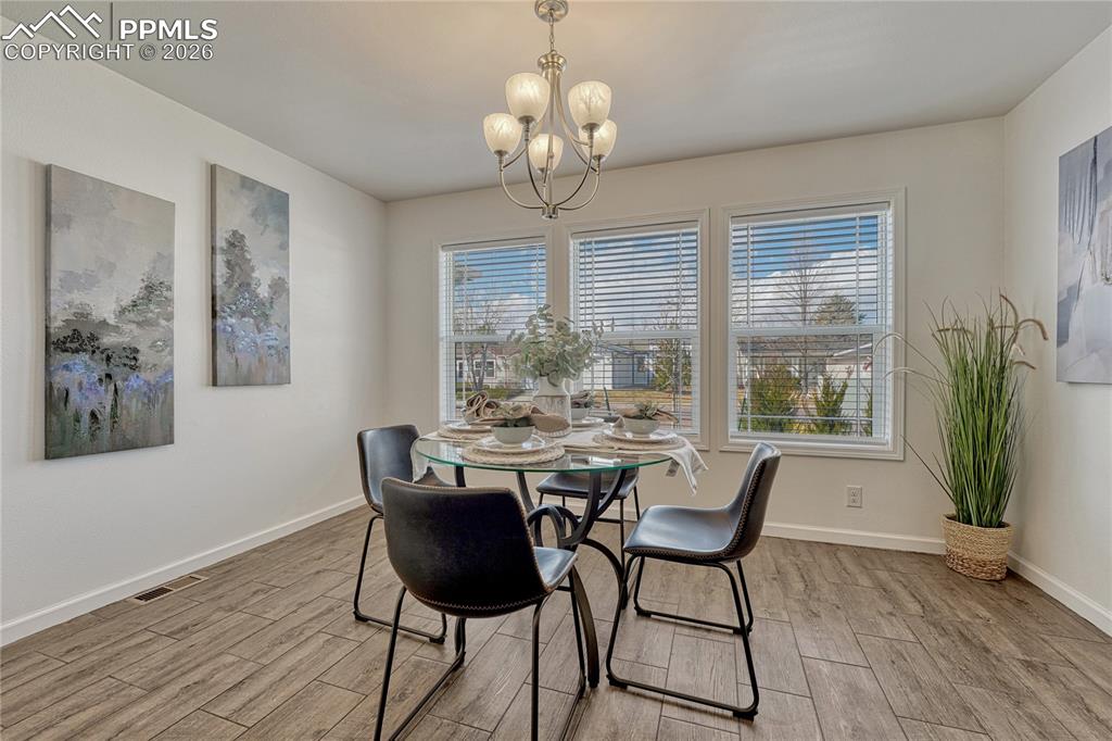 Oversized dining area overlooks the front yard and can fit most dining table sizes 
