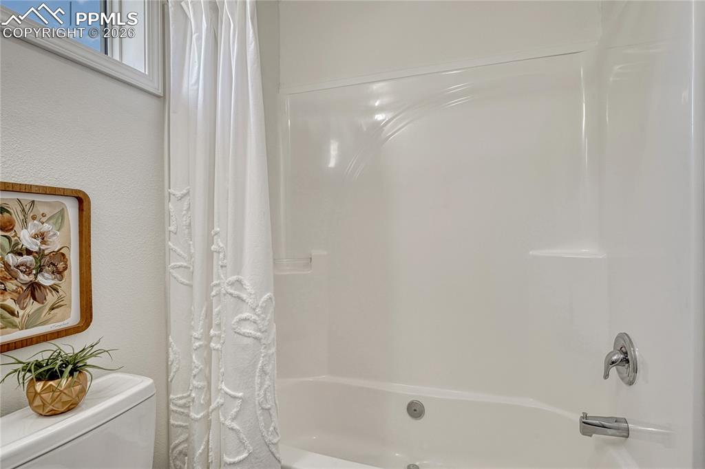 One piece shower and tub combo with built-in soap/shampoo shelves
