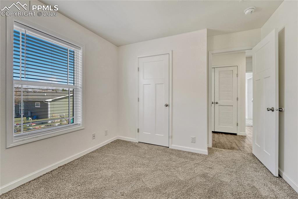 This bedroom faces North and is across from the hallway utility closet
