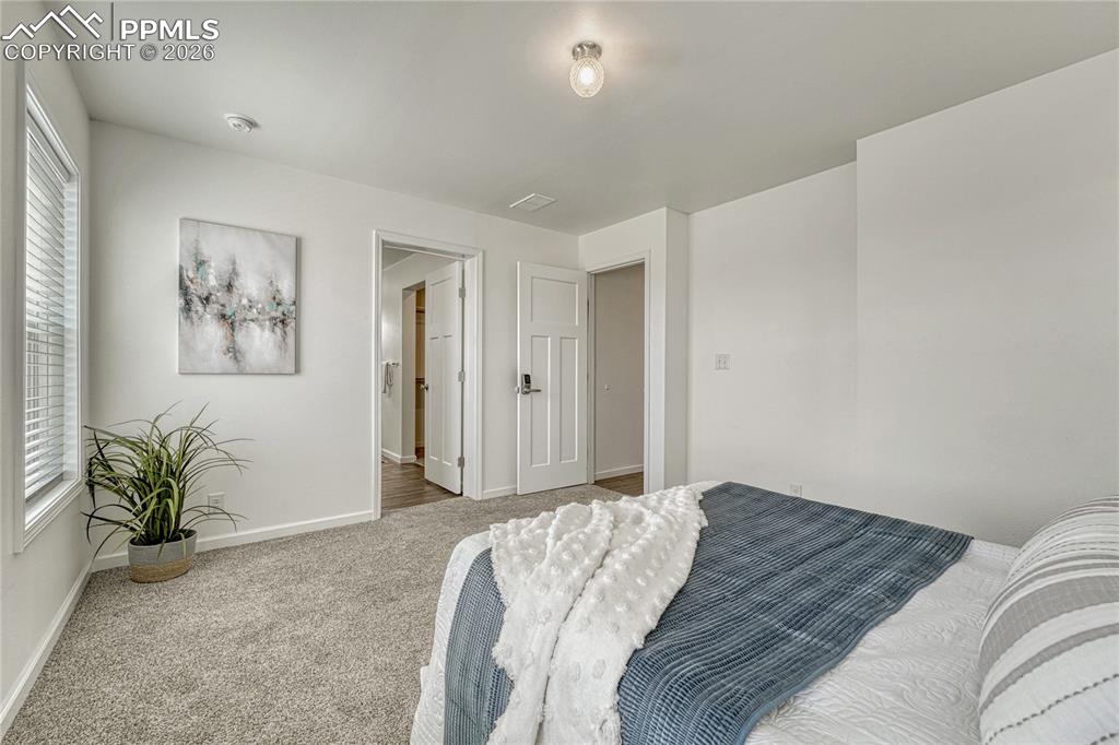 Primary bedroom features an en-suite bathroom with walk-in closet
