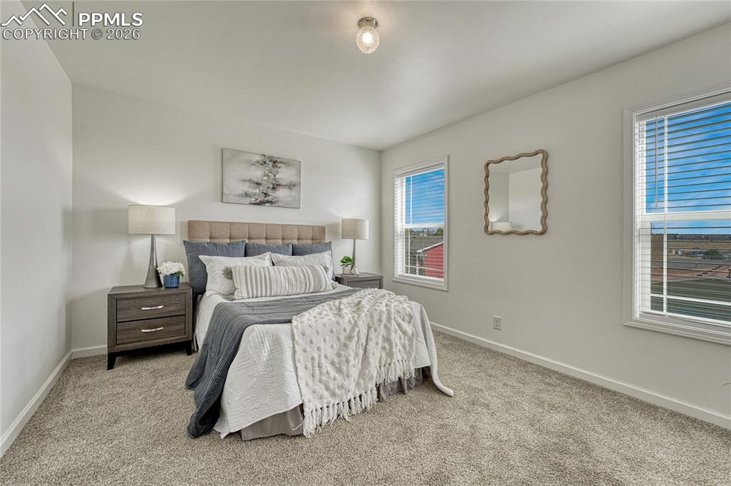 Two great East facing windows that overlook the back yard with views above the community
