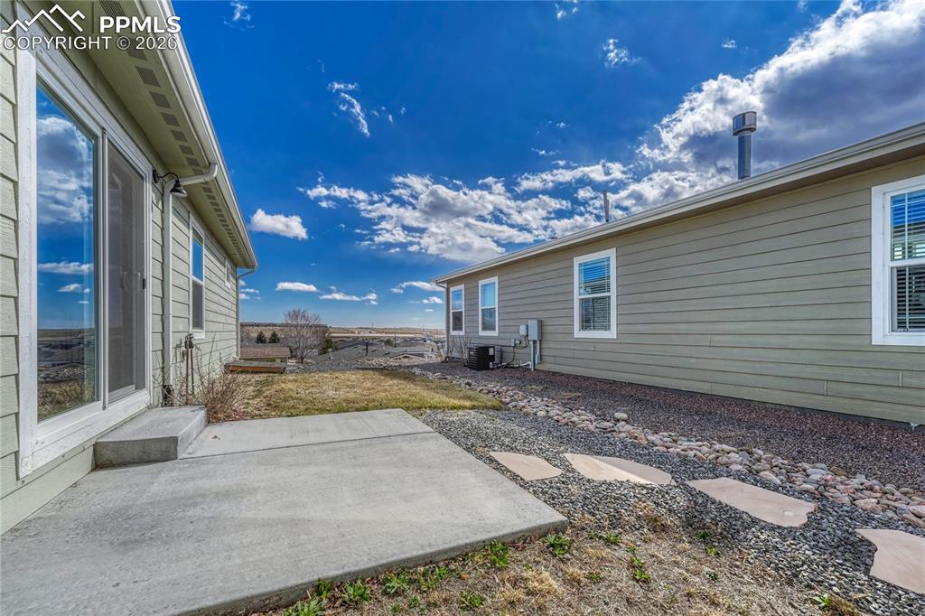 The yard features two grass areas and views to the East, perfect for morning coffee or relaxing
