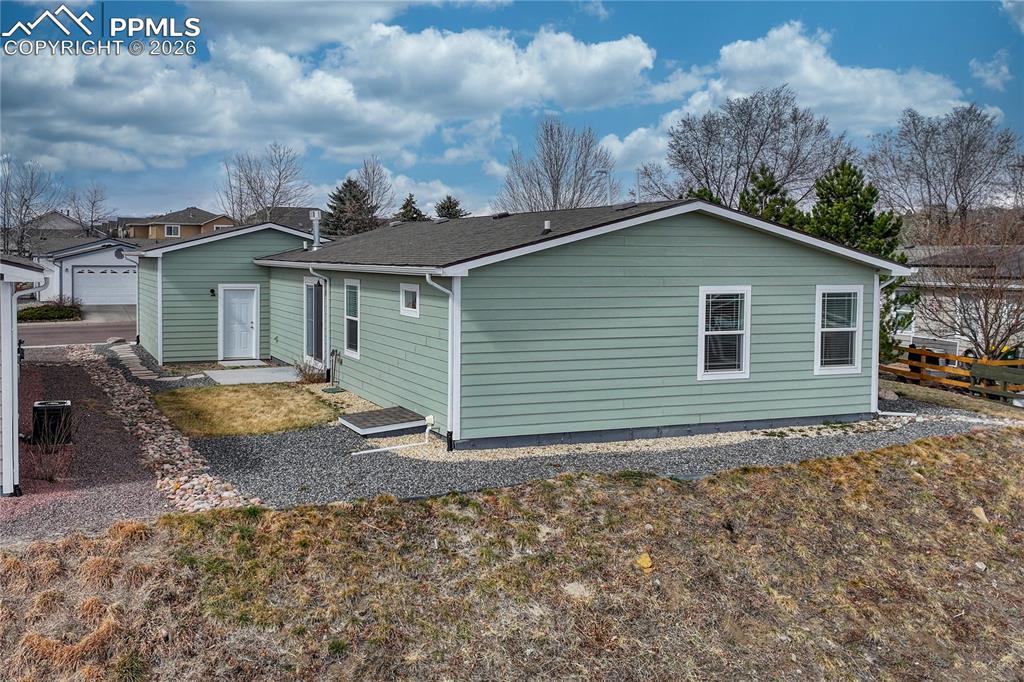 The side yard also has access to an encapsulated, entire-home crawl space where a sump pump is held
