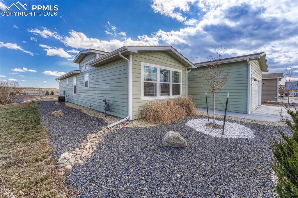 The side and front xeriscape landscaping offers design and character with low to no maintenance
