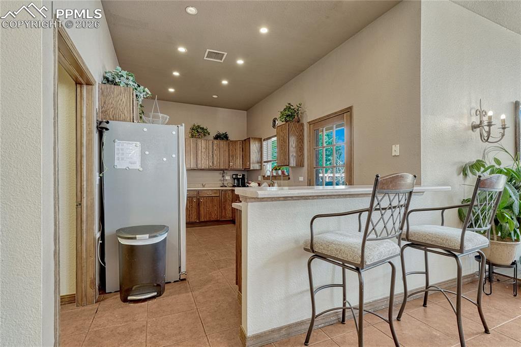 It even has its own full kitchen and breakfast bar
