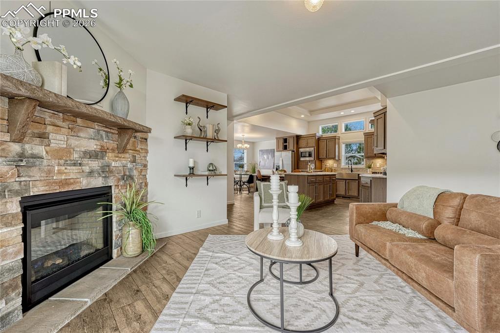 Stone surround and mantel along with a great amount of light from the South that bounces throughout the space
