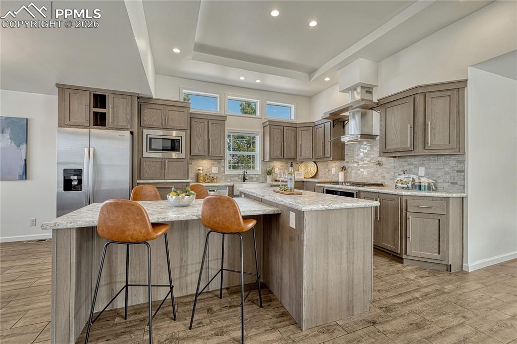 Massive amounts of cabinet storage and full height tile backsplash for added elegance
