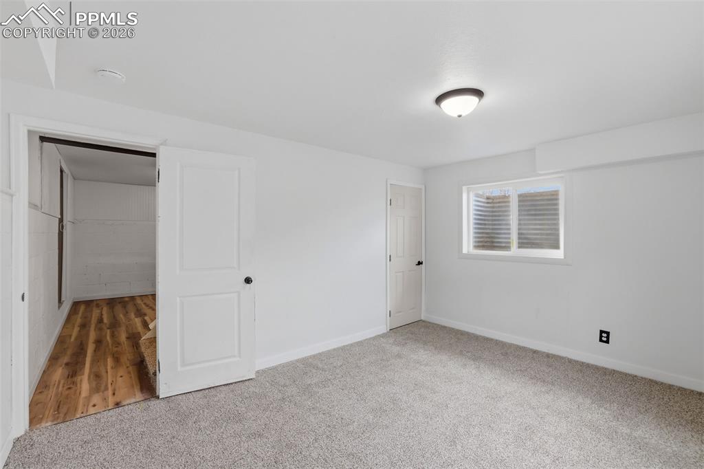 Unfurnished bedroom featuring carpet flooring