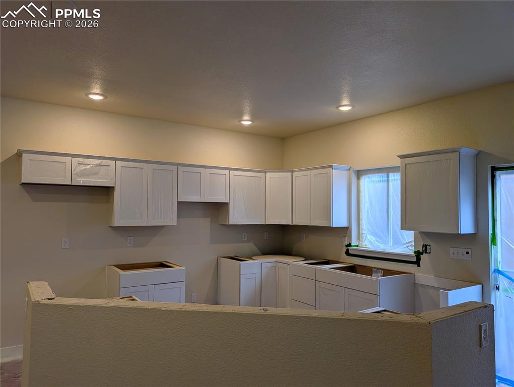 Kitchen will include full custom tile backsplash, 42in upper cabinets, 2 panel doors, and white shaker style cabinets