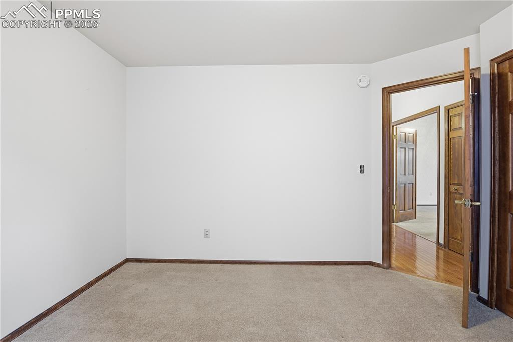 Spare room with carpet floors and baseboards