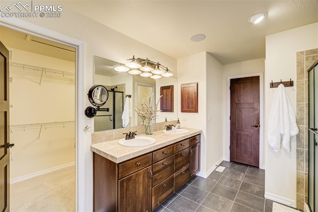 A double vanity and large walk-in closet