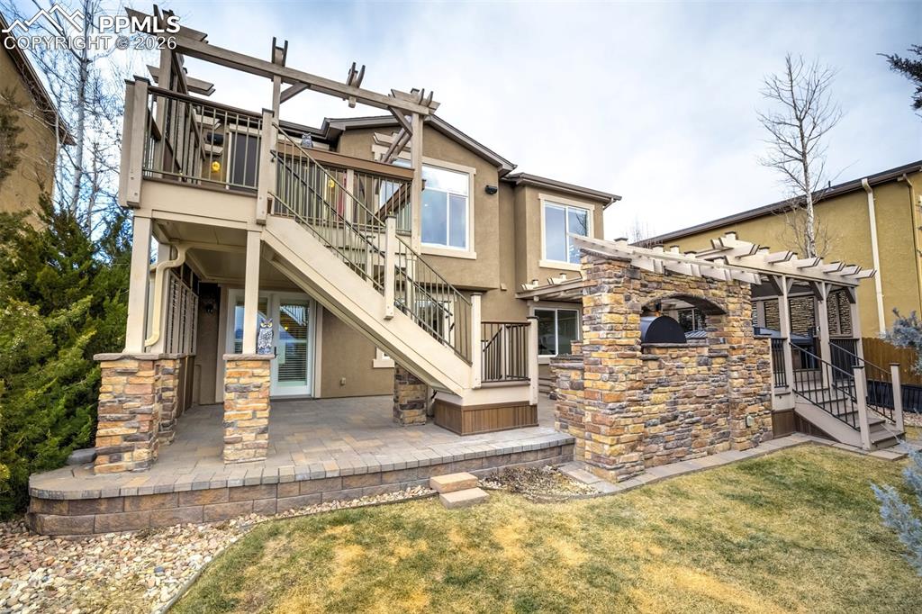 Back yard with covered patio and deck