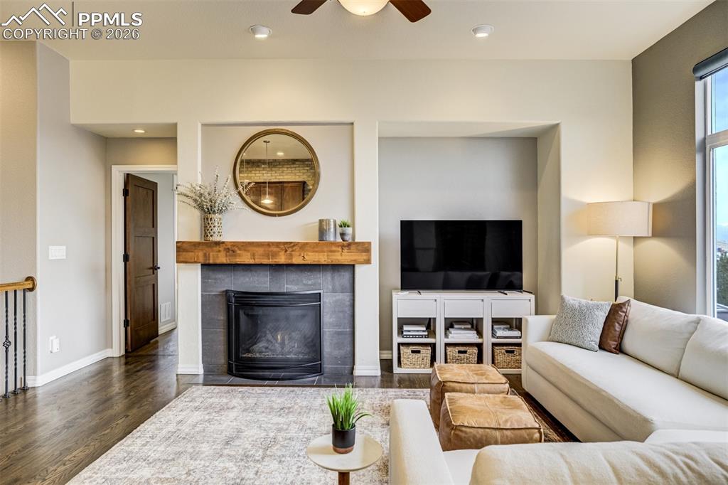 A gas fireplace featuring a knotty alder mantle 