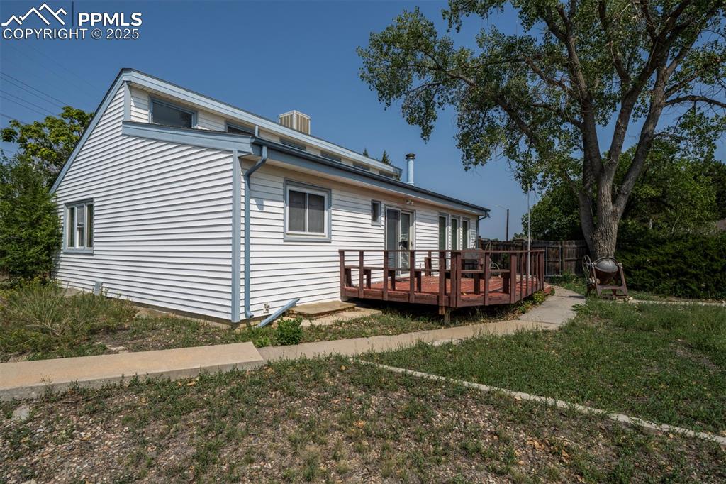 Concrete walk way to backyard deck, great for outdoor fun and entertaining.