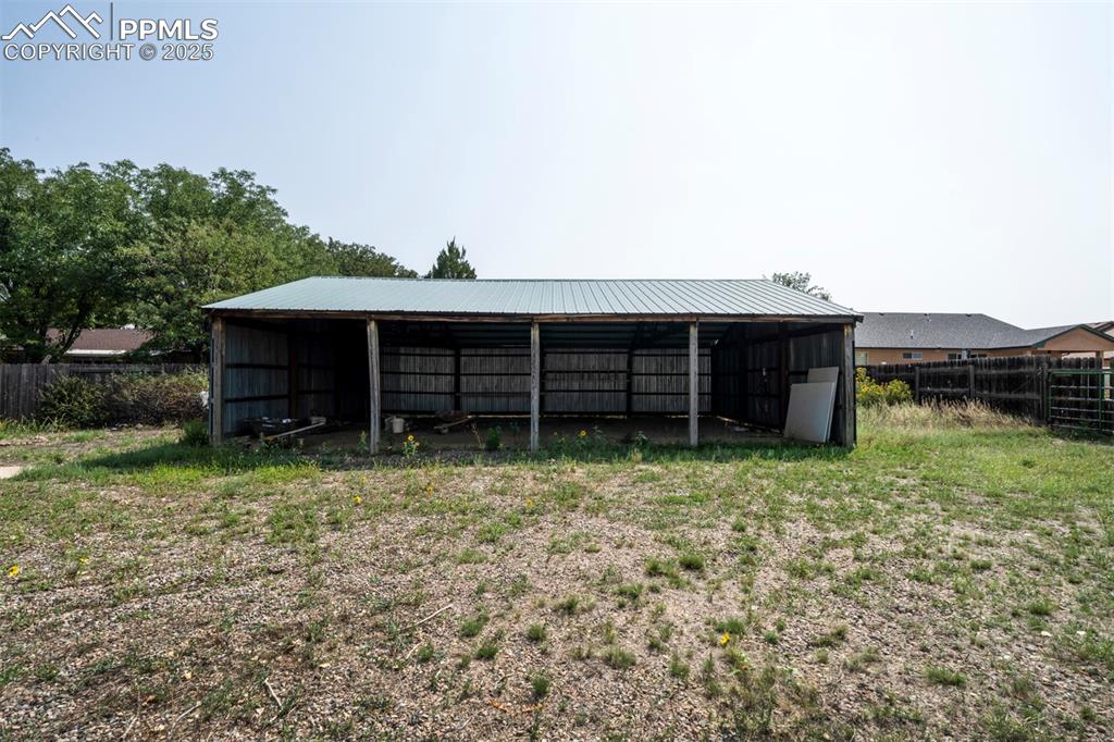 Pole barn for storing small boat or camper.