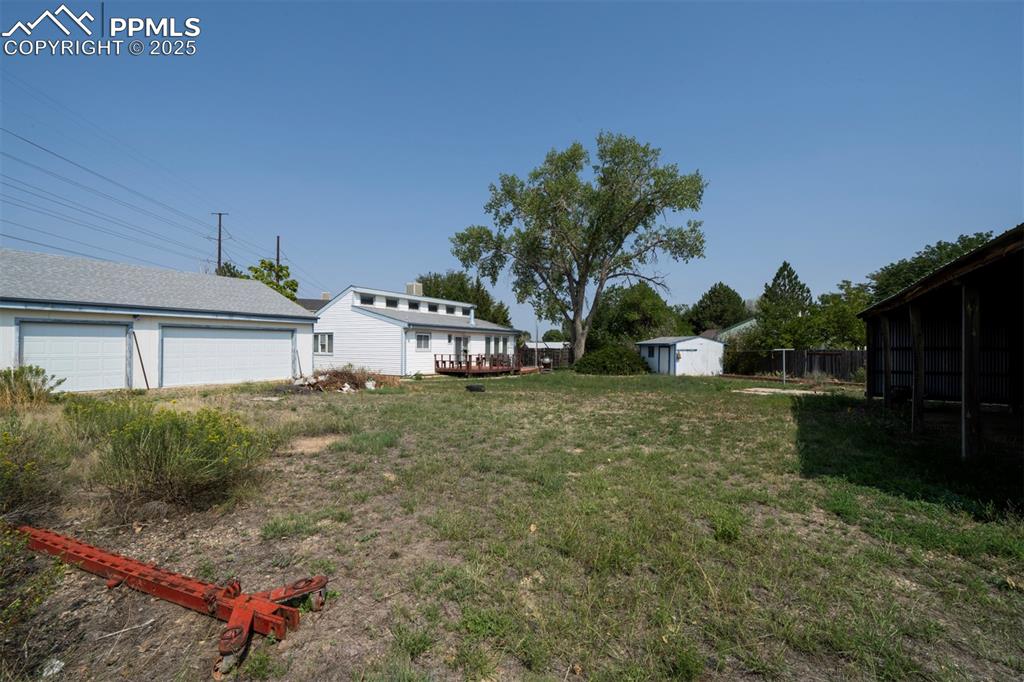 o.46-acre fenced cul-de-sac lot with 3-car detached garage, pole barn, and storage shed for tools and toys.