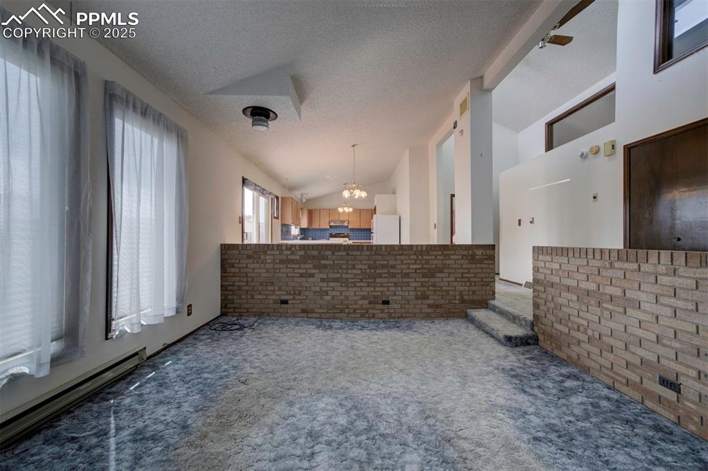 Attractive brick surround in Living Room.