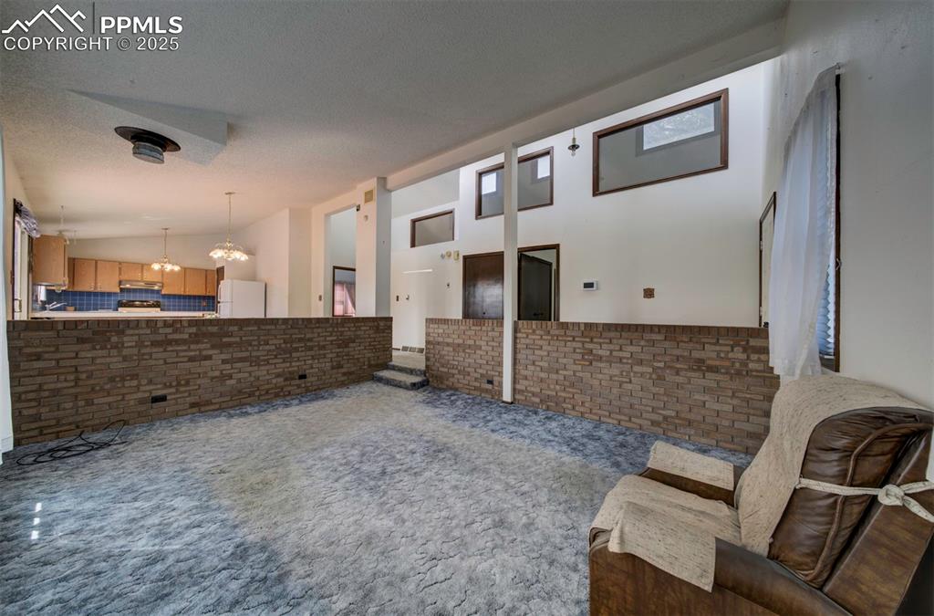 Living Room with brick surround.