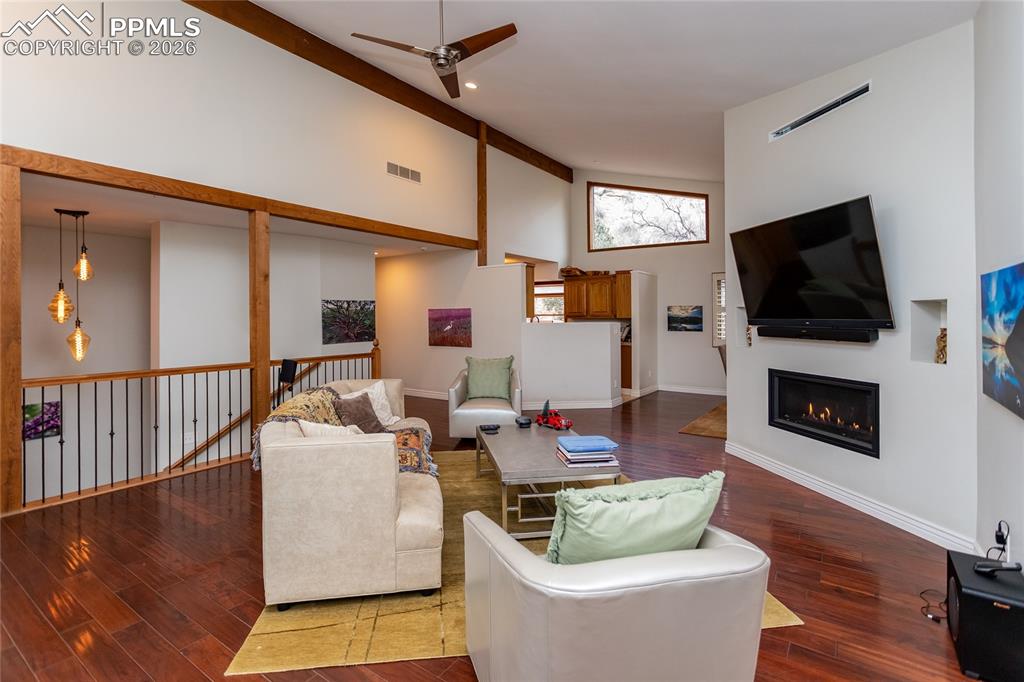 The living room is open to the dining room & kitchen for an easy entertaining flow & steps to the primary suite & the lower level too.