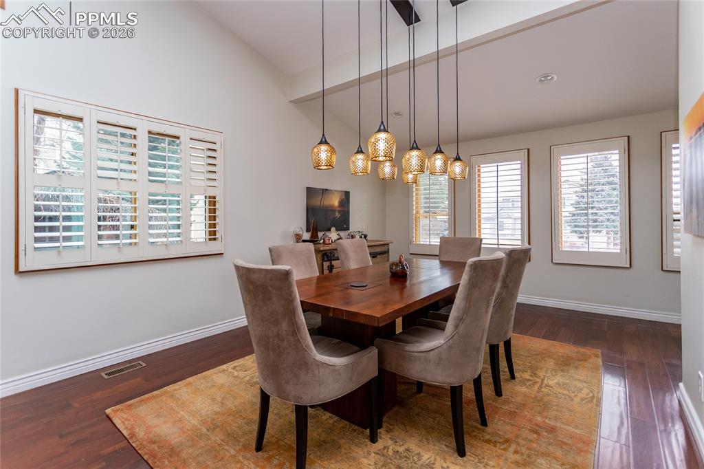 Large, open, light filled dining room with stunning light fixture. Plenty of room for family & friends.