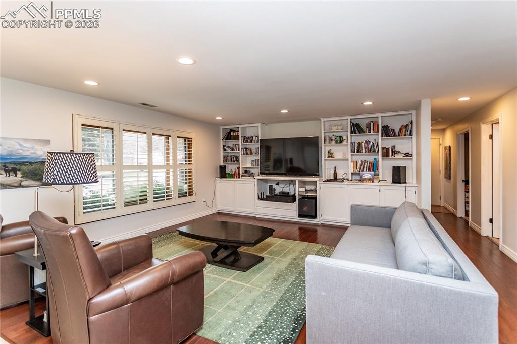 Large, inviting, bright family room with plenty of built-ins for electronic components, books & family treasures.