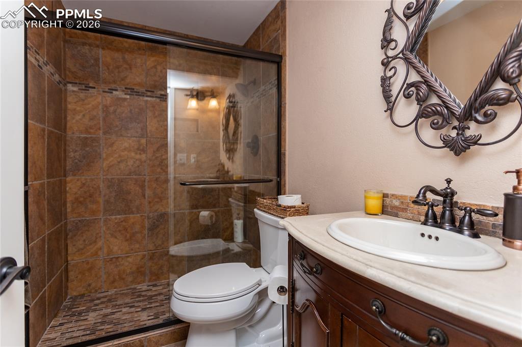 The 3/4 bathroom downstairs has recently been updated with beautiful tile & a spacious vanity for all of your family & guest needs. 
