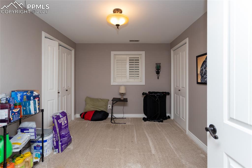 This cozy bedroom provides plenty of space for the family, guests or perhaps a workout room.