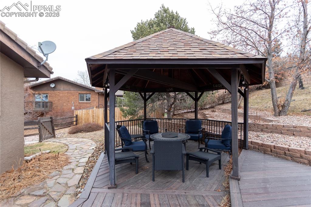 Custom, roomy, covered, gazebo lets you entertain out of the elements while still enjoying the beautiful surroundings.