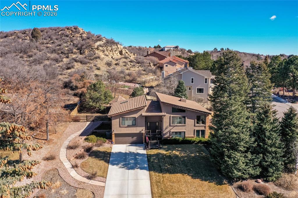 Look at this stunning home in this stunning setting!  A unique, spacious, beautiful, updated, family home, with a gorgeous landscaped yard with plenty of entertaining space, lots of mature trees & natural formations await you, your family & friends.  Come enjoy the good life!