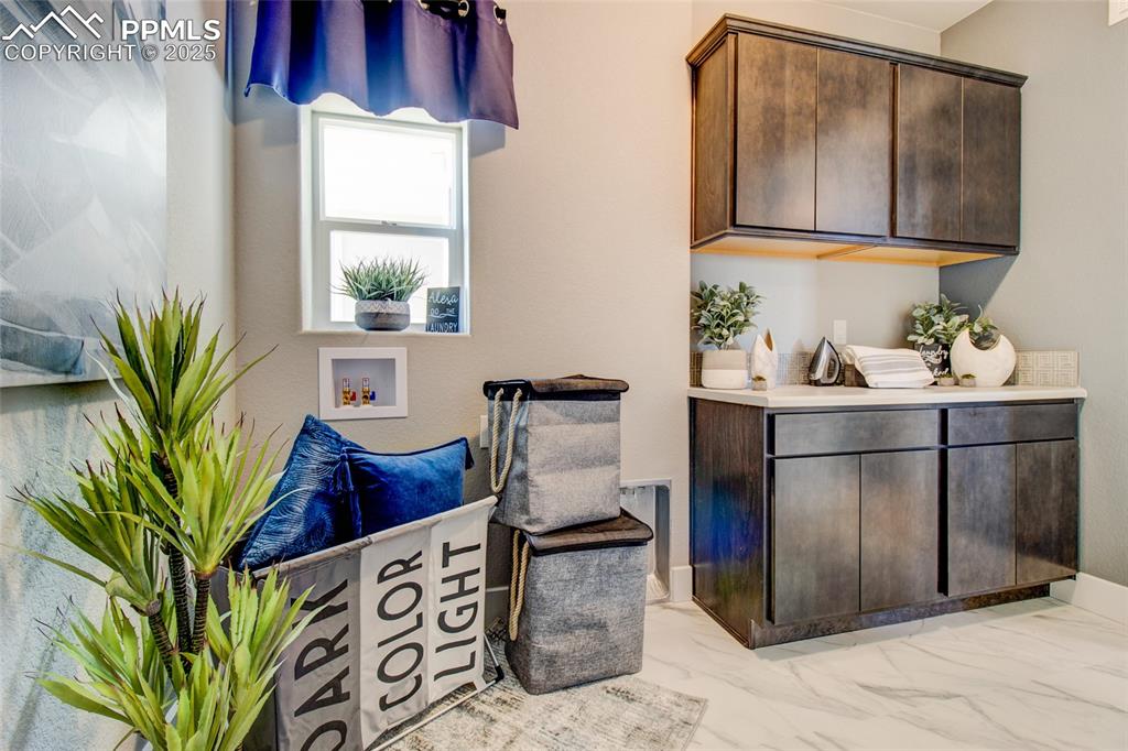 Sitting room featuring marble finish flooring