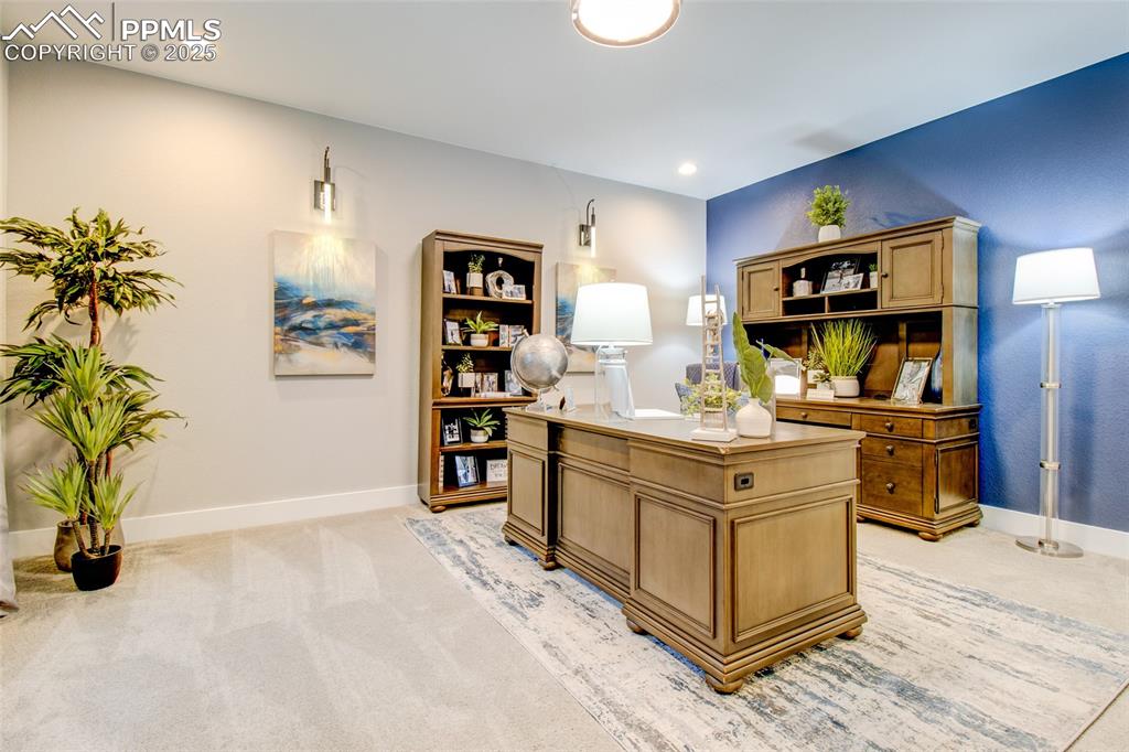 Office space featuring light carpet and recessed lighting