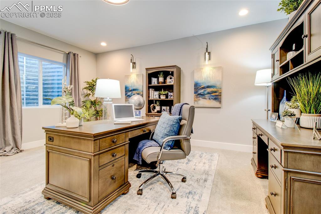 Office featuring light carpet and recessed lighting