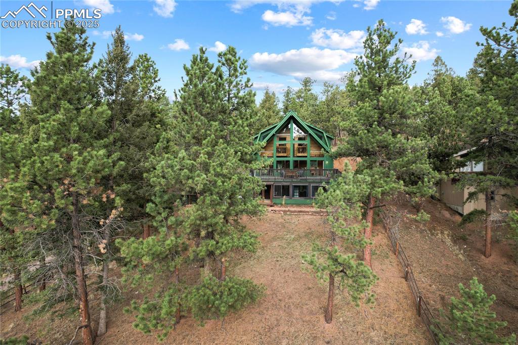 Back of house with a wooden deck