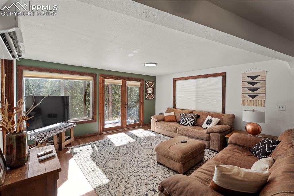Living area featuring wood finished floors and healthy amount of natural light