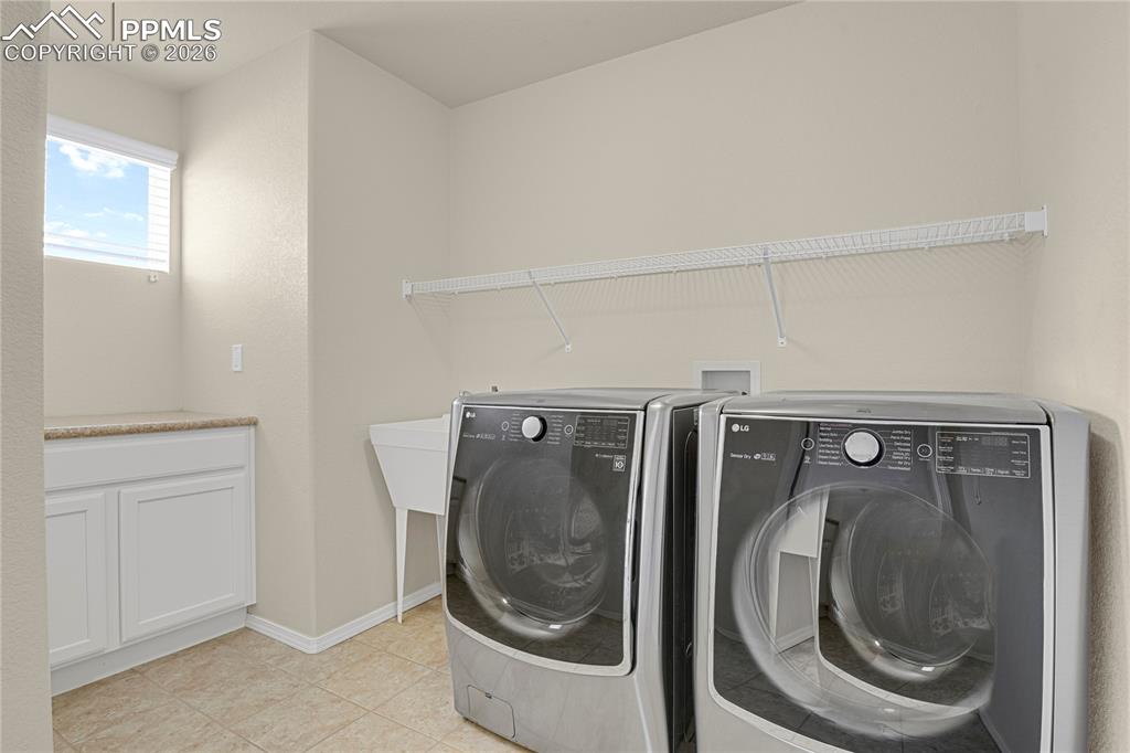 Convenient upper level laundry with utility sink. 