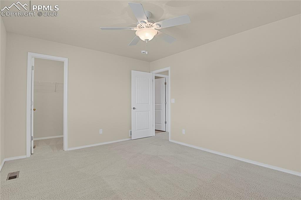 Spacious upper level bedroom with walk-in closet