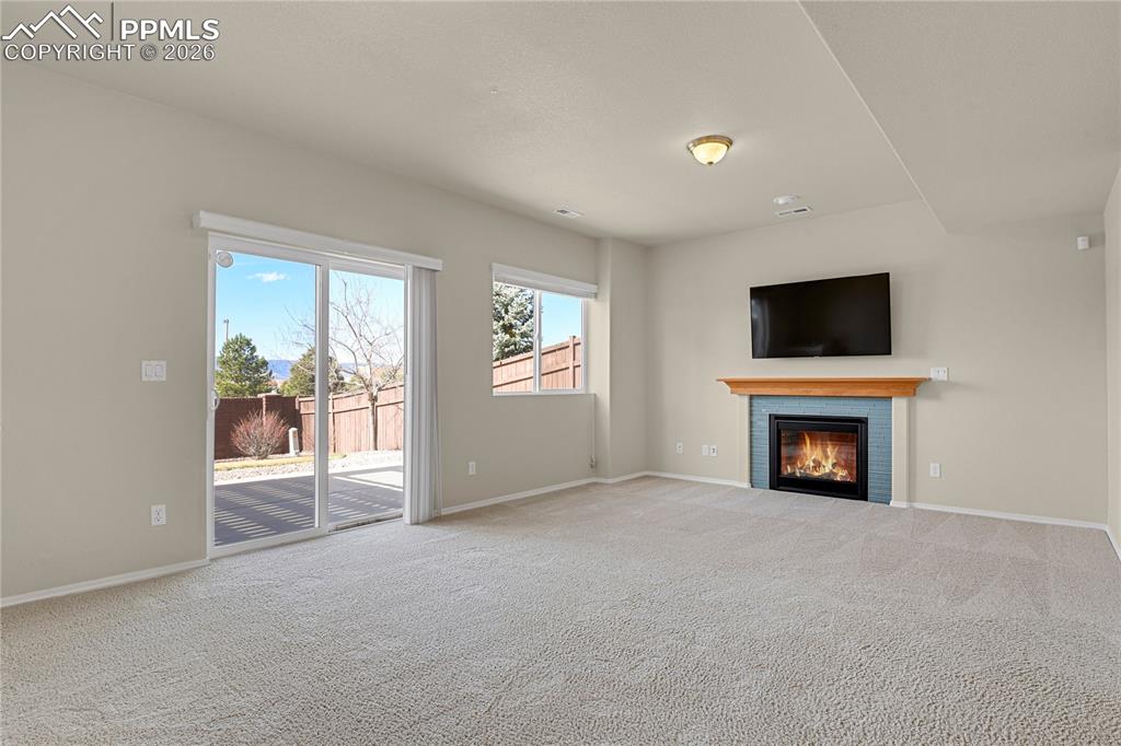 Lower level family room with gas fireplace. 