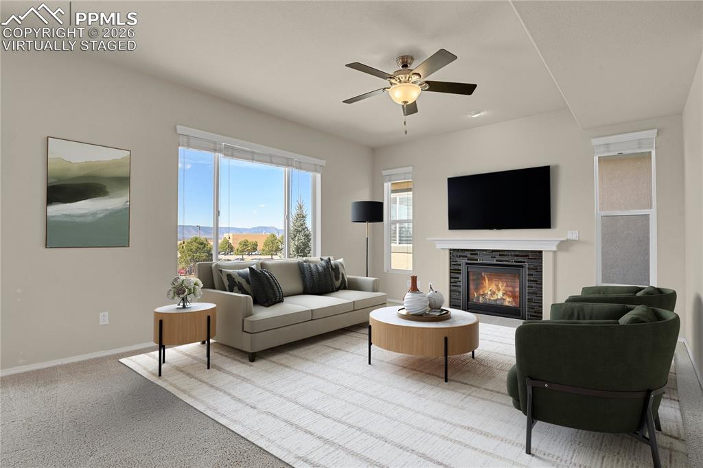 Living room with gas fireplace. Virtually Staged