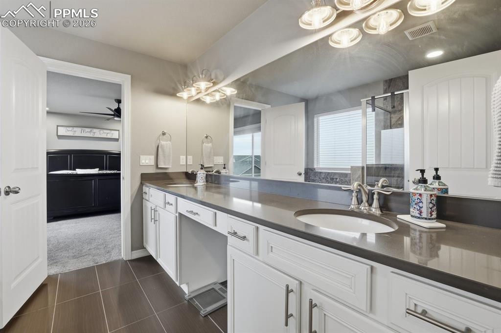quartz countertops, double vanity, updated lighting