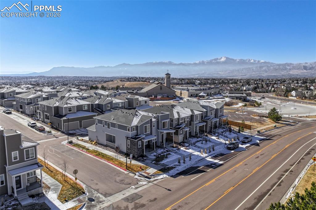 Aerial perspective of suburban area with a mountain backdrop