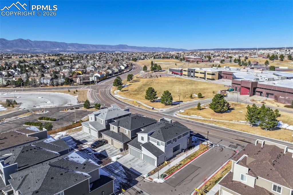 Aerial view of residential area featuring a mountain backdrop