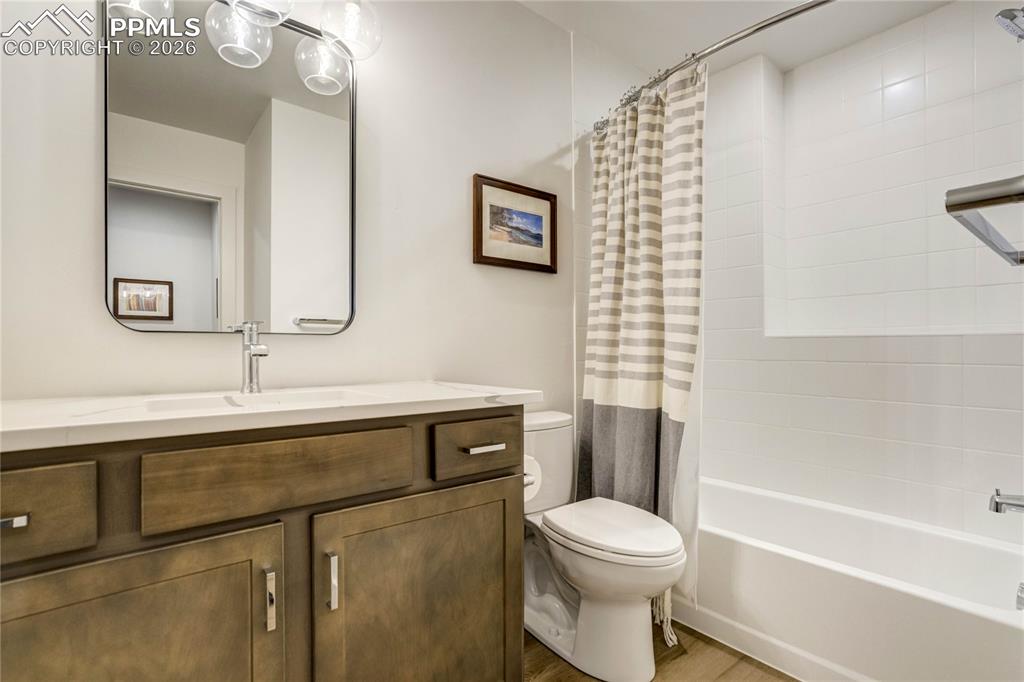 Designed with Cohesion in Mind, the Fourth Bath Features Quartz Countertops and Coordinated LVP + Tile Finishes That Reflect the Elevated Material Palette Found Throughout the Home. Clean Lines and Modern Fixtures Create a Polished, Contemporary Aesthetic