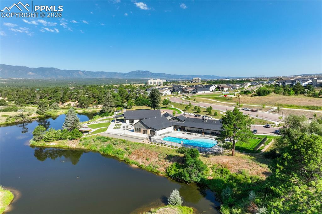 Located in the highly sought-after Farm community, residents enjoy approximately 135 acres of preserved open space, 25 acres of parks, scenic ponds, and connectivity to regional trail systems including LaForet and the New Santa Fe Trail. The Gathering Place clubhouse offers a resort-style pool, fitness facilities, meeting spaces, and community events, creating a true neighborhood lifestyle. Positioned within award-winning Academy District 20 School District